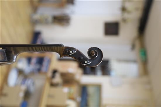 A mid 19th century German violin, bears Nicolas label, cased with a silver mounted bow, back 36cm